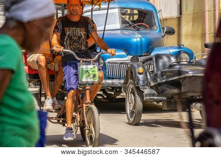 Havana, Cuba - May 16, 2019: Bicycle Taxi Driver In The Street Of Old Havana City During A Vibrant A