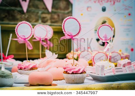 Raspberry Cupcake With A Sign For Inscription With A Bow
