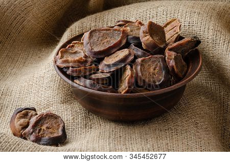 Dried Bull Eggs On Burlap. Dried Treats For Domestic Dogs. Pet Supplies. Selective Focus.