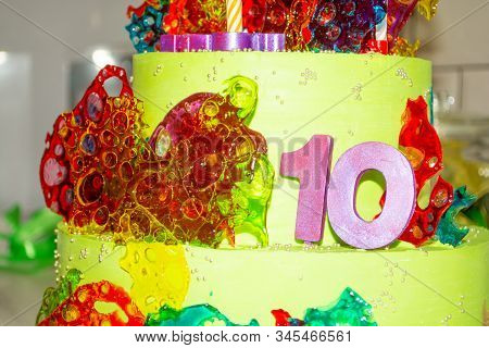 Big Green Birthday Cake With Number Ten For The Anniversary