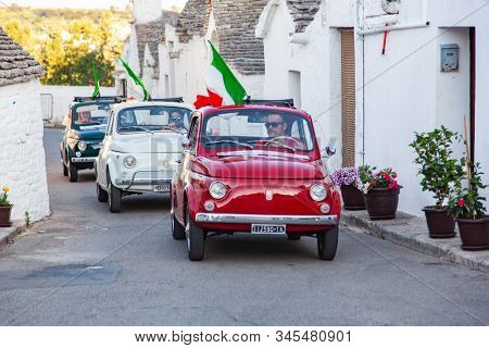 ALBEROBELLO, ITALY - JULY 2019: classic old Fiat cars in Alberobello, Italy