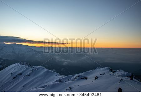 A View Of A Sunrise From The Summit