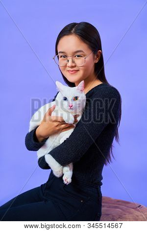 A Cat With A Different Eye Color, A Girl With Glasses Holds A White Cat, Bright Colours