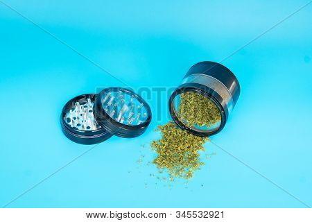 Close Up Of Cannabis - Marijuana Buds, Leaf And Accessories - Grinder, Rolling Papers And Rolled Joi
