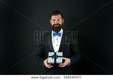 Gift Whatever You Want. Businessman With Gift Dark Background. Bearded Man Hold Gift Box. Boxing Day