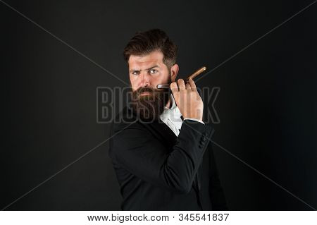 Barbershop For Gentlemen Only. Businessman Hold Barbers Tool Dark Background. Bearded Man Shave In B