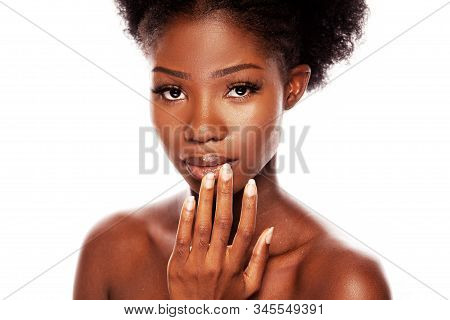 Sexy African American Woman Wth Passionately Look Touching Of Her Lips By Her Hand. Black Model Isol