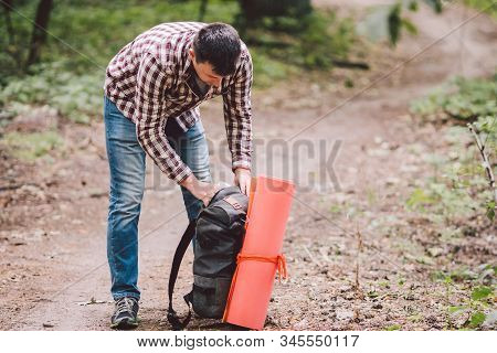 Guy With Backpack, Traveller, Hipster Standing In Woods, Hiking, Forest, Journey. Caucasian Tourist 