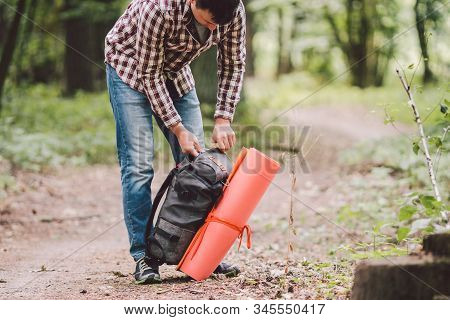 Guy With Backpack, Traveller, Hipster Standing In Woods, Hiking, Forest, Journey. Caucasian Tourist 