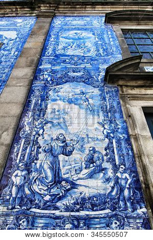 Oporto, Portugal- January 2, 2020: Beautiful And Old Tiled Facade Of Capela Das Almas Church In Opor