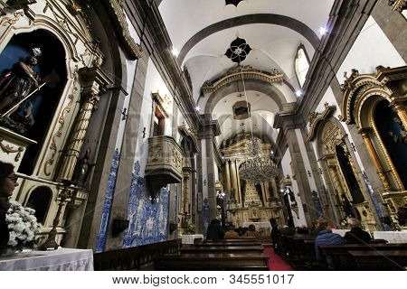 Oporto, Portugal- January 2, 2020: People Visiting The Beautiful Interior Of Capela Das Almas Church