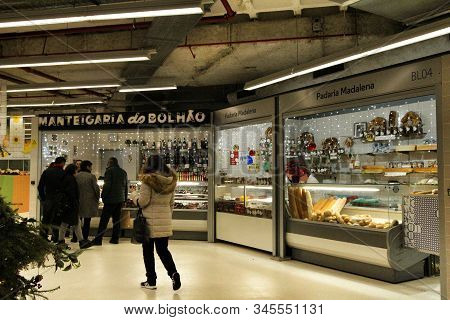 Oporto, Portugal- December 31, 2019: Portuguese People Buying Fresh Food At The Provisional Market O