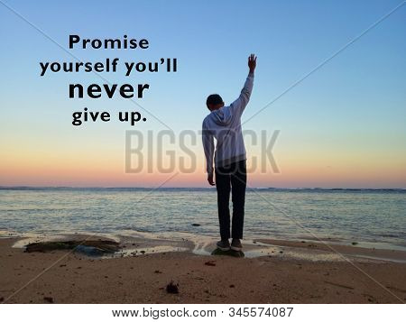 Inspirational Motivational Quote - Promise Yourself You Will Never Give Up. With Blurry Background O