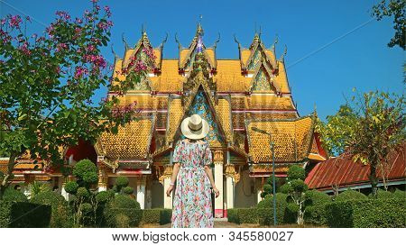 Female Traveler Being Impressed By The Gorgeous Wat Wang Wiwekaram Temple, Historic Place In Sangkhl