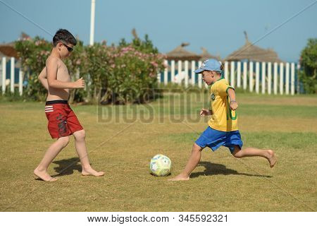 10 Th June, 2018, Sousse, Tunisia. Boys Playing Football On A Green Hotel Field During Their Summer 