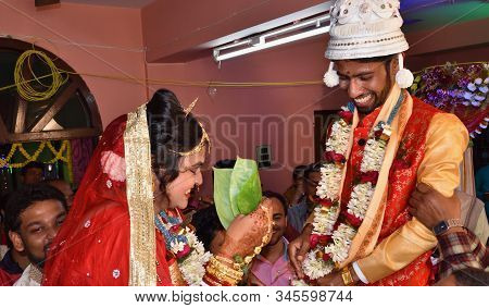 Midnapur, India - February 6, 2019: Indian Bride Hiding Her Face With Betel Leaf Also Called Paan. H