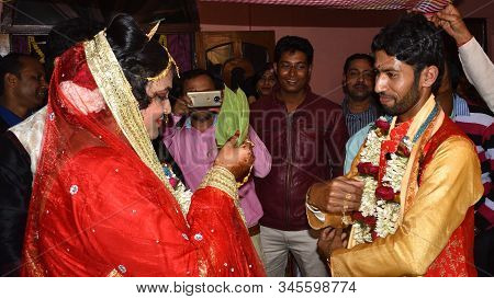Midnapur, India - February 6, 2019: Indian Bride Hiding Her Face With Betel Leaf Also Called Paan. H