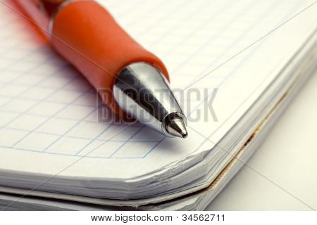 Ballpoint Pen On Notebook
