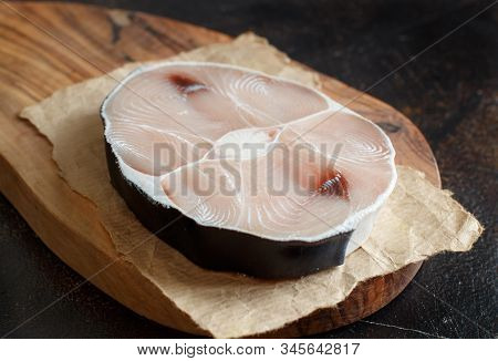 Two Shark Steak On A Dark Board Close Up
