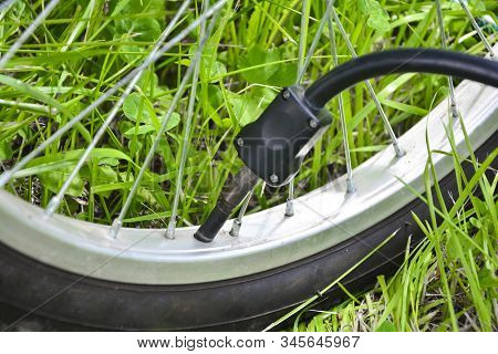 Inflating The Tire Of A Bicycle. Pumping Air Into A Wheel Of Bike. Home Maintenance Of Bike. Bicycle
