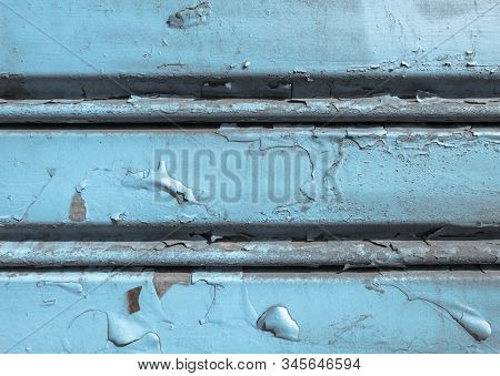 Background Of Old Metal Sheet With Peel Paint Texture Surface. Painted Metal Roller Shutters Door Wi