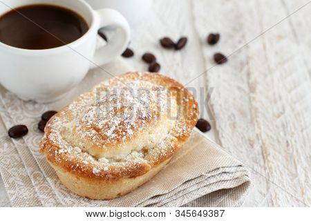 Cup Of Coffee With Pasticciotto Pastry On A Rustic Background Close Up