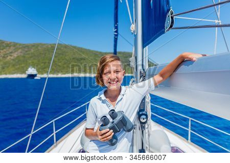 Little Boy On Board Of Sailing Yacht On Summer Cruise. Travel Adventure, Yachting With Child On Fami