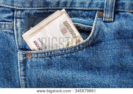 Russian Ruble Banknotes In The Front Left Pocket Of Blue Jeans. Concept Of Saving Money Or Pocket Ex