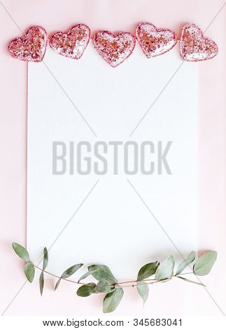 Background With Copy Space Blank On Pink Background With Pink Glittered Hearts, Eucalyptus Branch. W