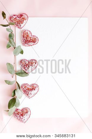 Background With Copy Space Blank On Pink Background With Pink Glittered Hearts, Eucalyptus Branch. W