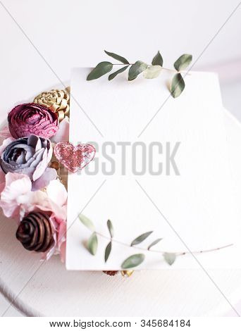 Background With Copy Space Blank On White Table With Glitter Heart, Eucalyptus Branch, Flowers And L