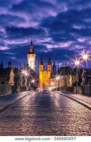 Old Main Bridge, Alte Mainbrucke With Statues Of Saints, Cathedral And City Hall In Old Town Of Wurz