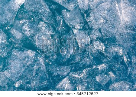 Winter background of frozen water. Natural winter background. Winter ice background.background Winter ice background desktop image. Space for text background. Background. Winter ice water surface background. Nature. Ice frozen water background. background