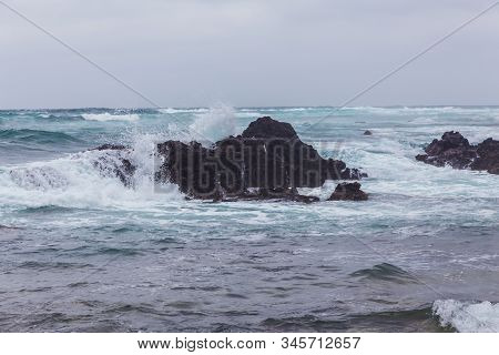 Beautiful Nature Sea Landscape Scene With Black Stone Of Jeju Island, South Korea
