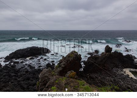 Beautiful Nature Sea Landscape Scene With Black Stone Of Jeju Island, South Korea
