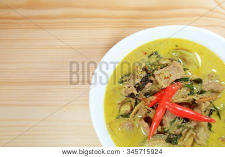 Top View Of Thai Green Curry Or Kaeng Keaw Wan With Beef Served On Wooden Table