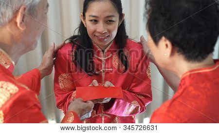 Daugther Give Red Envelop To Father Mother In Chiense New Year