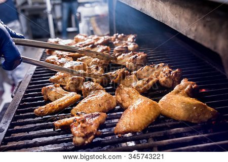 Fried Chiken Wings At Grill Barbecue. Restaurant.