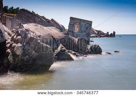 Liepaja Beach Bunker. Brick House, Soft Water, Waves And Rocks. Abandoned Military Ruins Facilities 