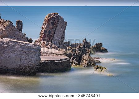 Liepaja Beach Bunker. Brick House, Soft Water, Waves And Rocks. Abandoned Military Ruins Facilities 