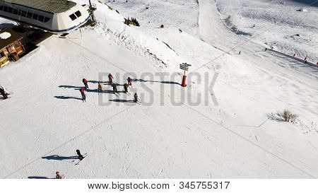 Majestic Winter Aerial Landscape And Ski Resort With Typical Alpine Wooden Houses In French Alps, Le