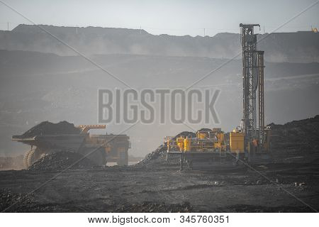 Open Mine Coal And Minerals From Bowels Soil Explosion. Drilling Rigs Borer Drill Wells For Installi