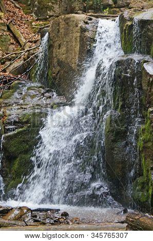 Skakalo Waterfall In The Carpathian Mountains Surrounded By Forest On A Spring Sunny Day