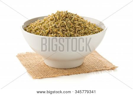 Heap Of Uncooked, Raw Freekeh Or Firik, Roasted Wheat Grain, In White Bowl Over White Background