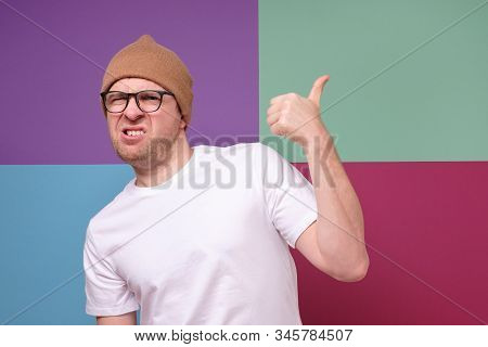 Man Wearing Glasses Points Finger Aside At Questionable Distrustful Announcement