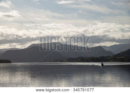 Epic Autumn Fall Landscape Of Ullswater And Surrounding Mountains And Hills Viewed From Hallin Fell 