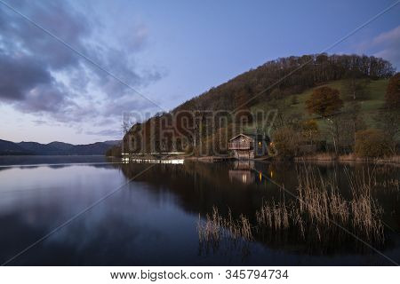 Epic Vibrant Sunrise Autumn Fall Landscape Image Of Ullswater In Lake District With Golden Sunlight
