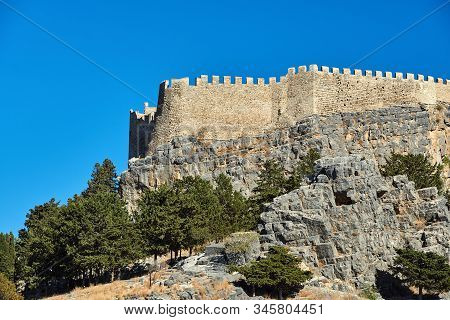 Medieval Walls Of A Fortress Of The Joannite Orders On Top Of A Rock In The City Of Lindos