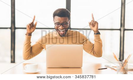 Hooray. Excited Black Businessman Having Excellent Idea, Finding Solution To Problem, Fingers Up, Co