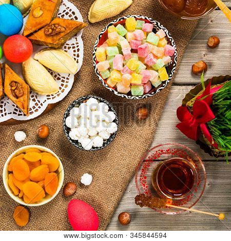Novruz Ramadan In Azerbaijan. Colored Eggs, Wheat Springs For Easter And Traditional Sweets. Selecti